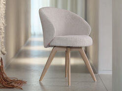 Fauteuil en tissu bouclé Neo avec pieds en bois de chêne